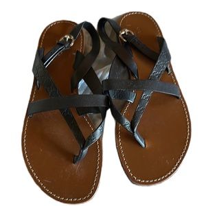 Women’s Gucci Sandal. Embossed black leather.